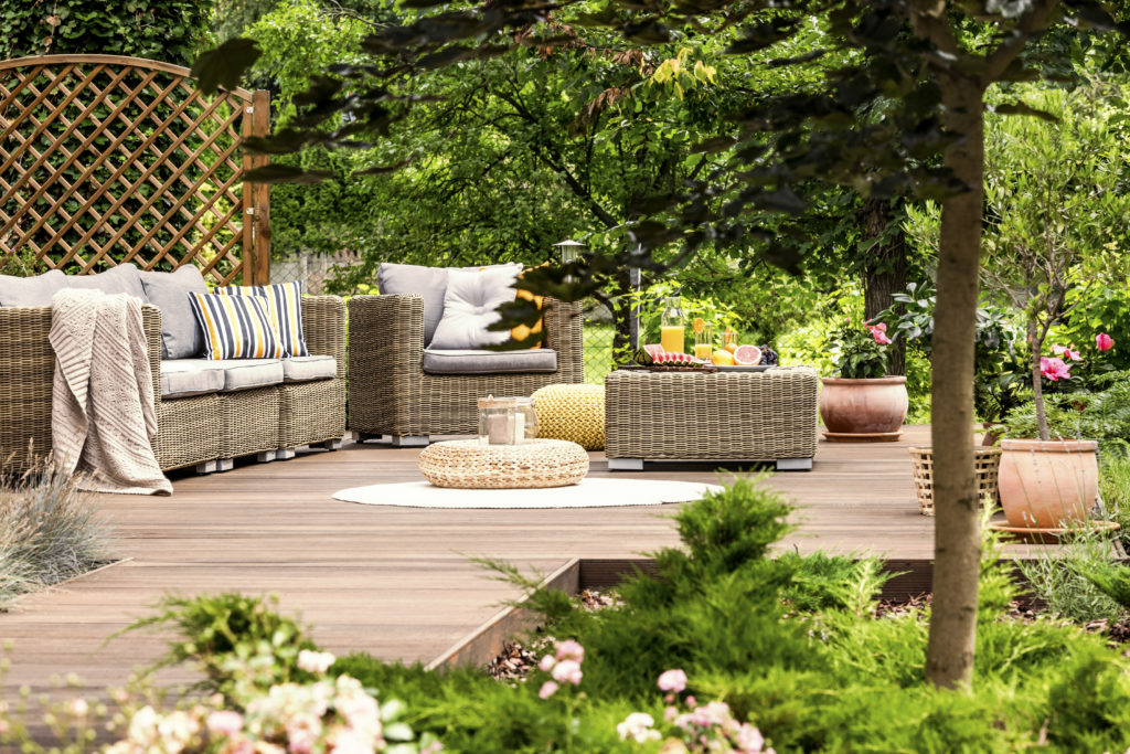 beige outdoor furniture on a deck