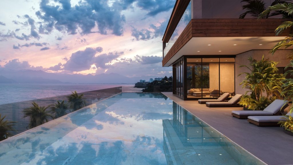 Luxury large fiberglass pool at the side of a building - Pools By York