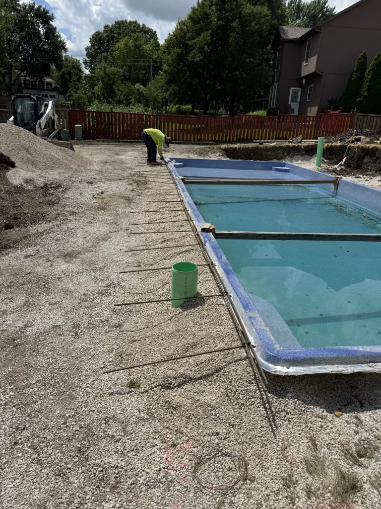 Pools By York crew inspecting a build in progress